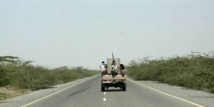 Saudi-backed forces ride in their vehicle,in Hodeida,Yemen.