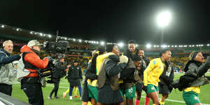 South African players celebrate after beating Italy to make the knockout stage.