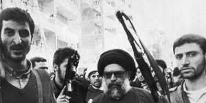 Lebanese Shiite leader Mohammed Hussein Fadlallah is flanked by bodyguards in March 1985 as he attends a funeral ceremony in Beirut for more than 75 people killed in an attempt on his life. The attack is believed to have been carried out by Saudi agents at the CIA's instigation.