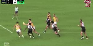 Sam Powell-Pepper collides with Adelaide’s Mark Keane,who was concussed in the incident.