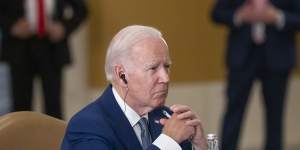 Joe Biden listens during a meeting with Chinese President Xi Jinping on the sidelines of the G20 summit.