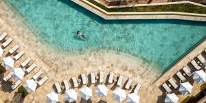 A guest luxuriates in one of two swimming pools at Six Senses Ibiza.
