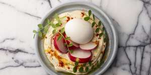 The tahini-rich hummus comes with crunchy radish and a cold smoked,soft boiled egg.