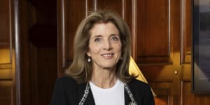 US ambassador to Australia Caroline Kennedy at her residence with a signed portrait of her father,Us President John F Kennedy