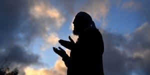 Mufti Zeeyad Ravat leads a prayer at a makeshift memorial at the Al Noor Mosque in Christchurch.