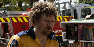 Rural Fire Service members aid the clean-up in Eugowra on Wednesday.