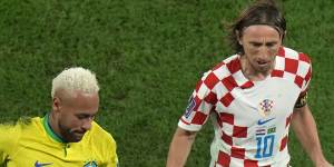 Brazil’s Neymar,left,and Croatia’s Luka Modric vie for the ball.