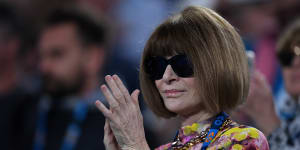 Vogue editor Anna Wintour applauds after watching Serena Williams of the United States defeat Simona Halep of Romania during day eight of the Australian Open tennis tournament in Melbourne.