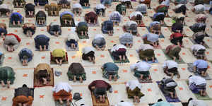 Indonesian Muslims practice social distancing while praying last month.