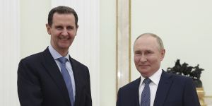 Bashar al-Assad and with ally Vladimir Putin at a meeting in Moscow in July.