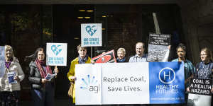 Public healthcare workers gathered outside AGL’s annual investor meeting in Melbourne calling for a faster exit from coal.