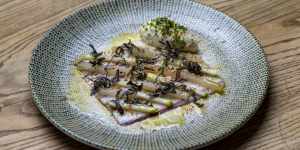 Smoked eel is layered with diagonal strips of crunchy apple and pickled kohlrabi.