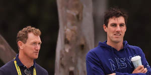 Chief selector George Bailey watches a Shield match alongside Pat Cummins.