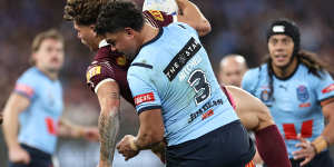 Mitchell slams Queensland superstar Reece Walsh at the MCG on Wednesday.