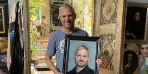 Brett Sutton holding a study of him by Vicki Sullivan,in the leadup to her painting him for the Archibald.