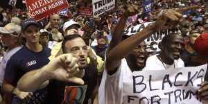 QAnon followers at Donald Trump's Tampa rally on Tuesday.