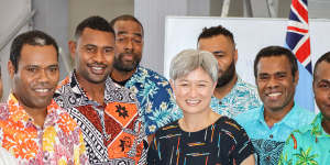 Penny Wong meets Australian-bound Fijian workers in Suva on Friday.