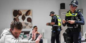 First responders talk to same-sex couple “John” and “David” in a family violence training scenario at the Police Academy.