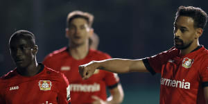 Bayer Leverkusen players celebrate after Karim Bellarabi's (right) goal in the 3-0 win over Saarbrucken.