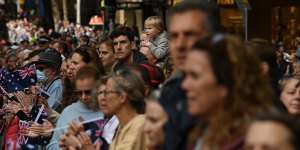 Crowds line Elizabeth Street in Sydney’s CBD to watch the Anzac Day march.