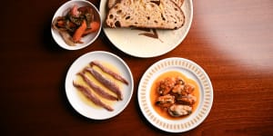 Clockwise from top right:House-baked sourdough bread with mussels escabeche,anchovies and pickles.
