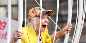 Dame Vivienne Westwood in a suspended giant bird cage in protest for Julian Assange at London’s Old Bailey in July 2020.