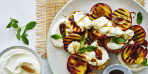 ***EMBARGOED FOR SUNDAY LIFE,JANUARY 29/23 ISSUE*** Adam Liaw recipe:Grilled peaches with coconut yoghurt and brown sugar Photography by William Meppem (photographer on contract,no restrictions)