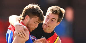 Zach Merrett,right,is returning to the Bombers'leadership group after a hiatus. 