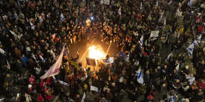 Protesters start a fire at a Tel Aviv protest calling for the release of all hostages,and against Israeli Prime Minister Benjamin Netanyahu’s government.