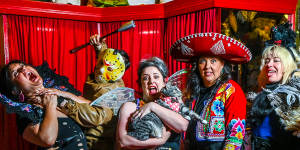 Staff get scary at Rose Chong Constumiers in Fitzroy,Melbourne. From left:Mia Rizzi,Dan Knight,Hannah Cuthbertson (with cat Harpo Marx),Ali Grixti and Abi Wright.