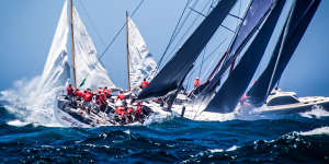 Wild Oats XI and other yachts in a heavy swell enter the Pacific Ocean from Sydney,the point at which the race is just getting going.
