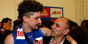 Tom and Tony Liberatore share a moment after the 2016 premiership.