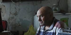 Maria Kruglova,83,is bedridden and is cared for by her son Sergei Kruglova,who is cleaning up debris from their home and garden in Lozova. Her next-door neighbour was killed when Russian artillery strikes destroyed his home. 