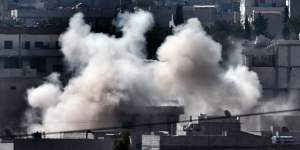 Smoke rises from the Syrian town of Ain al-Arab,known as Kobane by the Kurds,as Islamic State jihadists push to take the town.