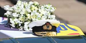 Prince Philip’s Royal Navy cap rests on his coffin. 