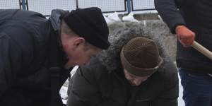 Volunteers fill sandbags to build barricades in Odesa,Ukraine.