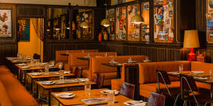 The bright orange dining room of Jimmy’s Falafel in Sydney.