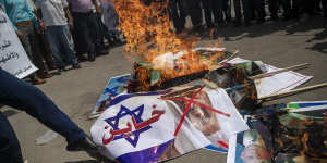 Palestinians in Gaza burn pictures of US President Donald Trump,Israeli PM Benjamin Netanyahu,Bahrain King Hamad bin Isa al-Khalifa and Abu Dhabi Crown Prince Mohammed bin Zayed al-Nahyan,during a protest against the UAE and Bahraini normalisation agreement with Israel.