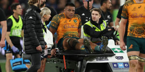 Allan Alaalatoa is carted off the ground at the MCG.