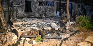 A house is destroyed after being burnt by Hamas militants during the attack at Kibbutz Be’eri,near the border with Gaza.