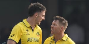 David Warner congratulates teammate Mitchell Marsh for scoring a century during the ICC Men’s Cricket World Cup match between Australia and Pakistan.