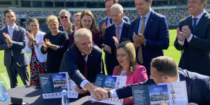 Prime Minister Scott Morrison,Queensland Premier Annastacia Palaszczuk and Brisbane lord mayor Adrian Schrinner signing the SEQ City Deal at the Gabba.
