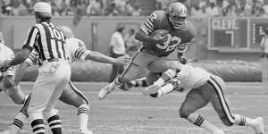 San Francisco 49er O.J. Simpson takes to the air as Cleveland Brown’s Thom Darden makes the tackle during an NFL game on September 3,1978.