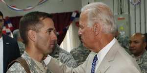 Beau Biden and his father,US Vice-President Joe Biden,meet at Camp Victory on the outskirts of Baghdad in July 2009. 
