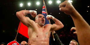 High point:Mundine celebrates after beating Antwun Echols for the WBA Super Middleweight title at the Sydney Entertainment Centre in 2003.