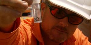 Justin Gibson,senior handler BioSecurity Queensland,holds a red fire ant sample.