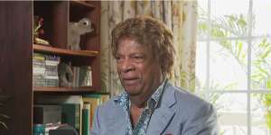 Kamahl has been charged with stalking and intimidating behaviour towards a woman.