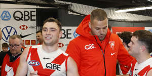 Lance Franklin celebrates with the Swans after their victory over the Bombers,during which he was subbed off with a calf injury.