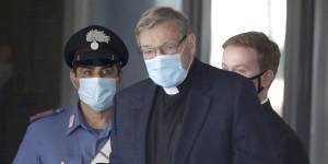 Cardinal George Pell returns in Rome amid reports of an elaborate conspiracy to influence his trial.