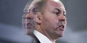 Treasurer Josh Frydenberg has sliced $2 billion off this year's forecast surplus.